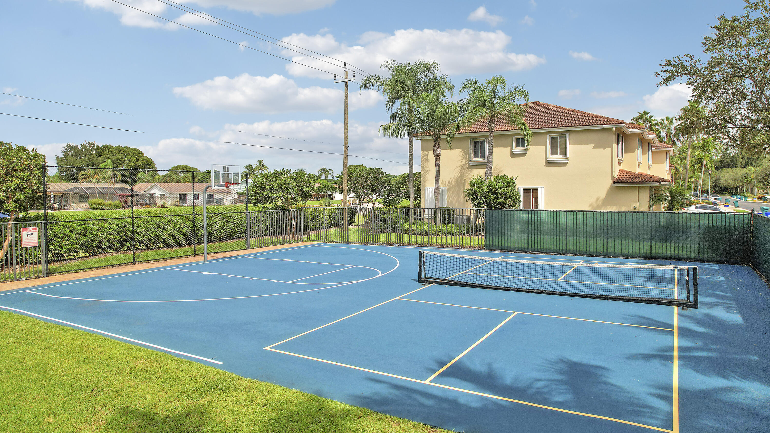 3172 North Greenleaf Circle Boynton Beach, FL 33426 - Photo 12 of 40 a view of a tennis court