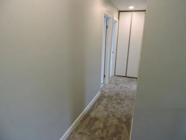 a view of hallway with closet