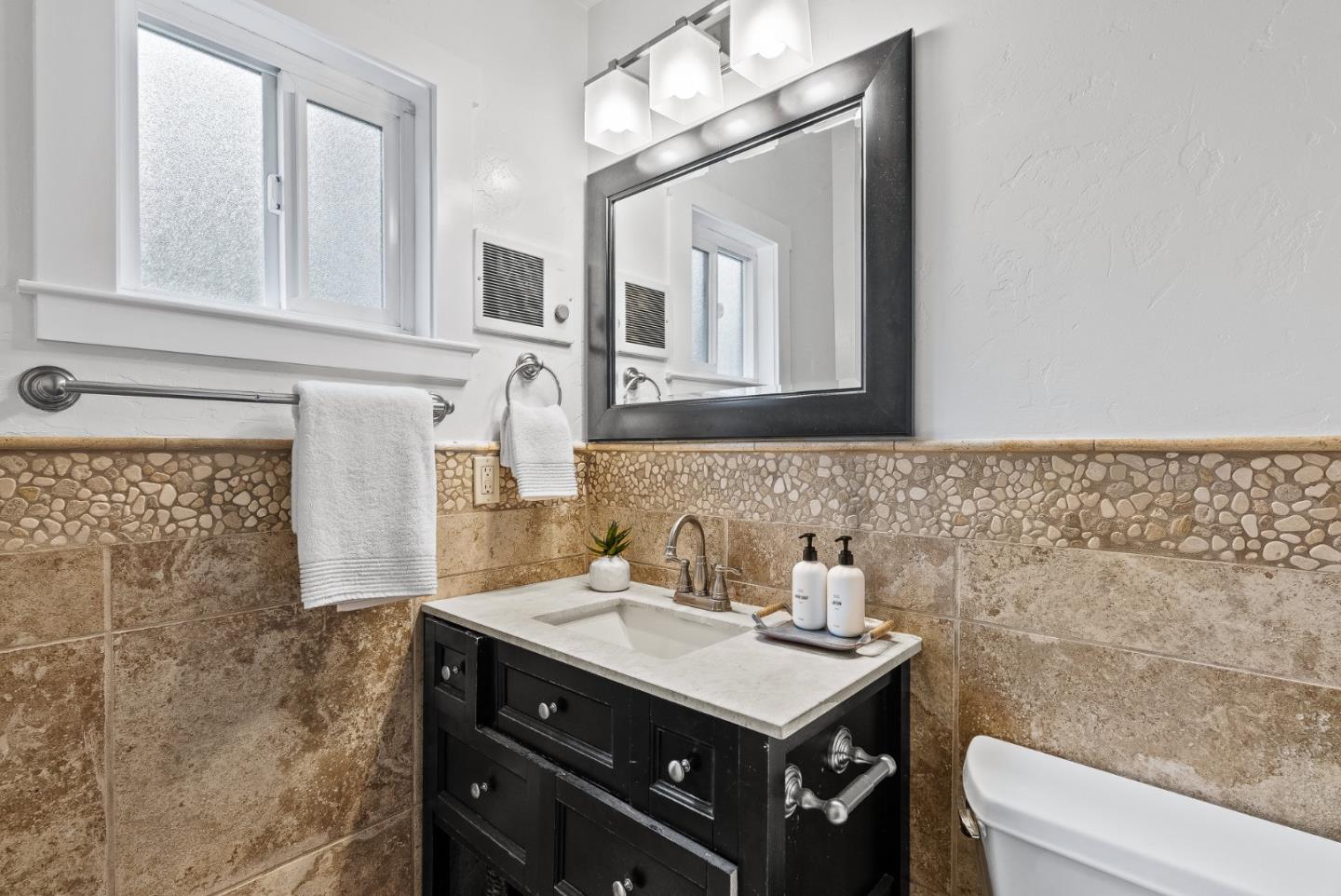 140 Baker Road Aptos, CA 95003 - Photo 10 of 20 a bathroom with a sink a toilet and a mirror