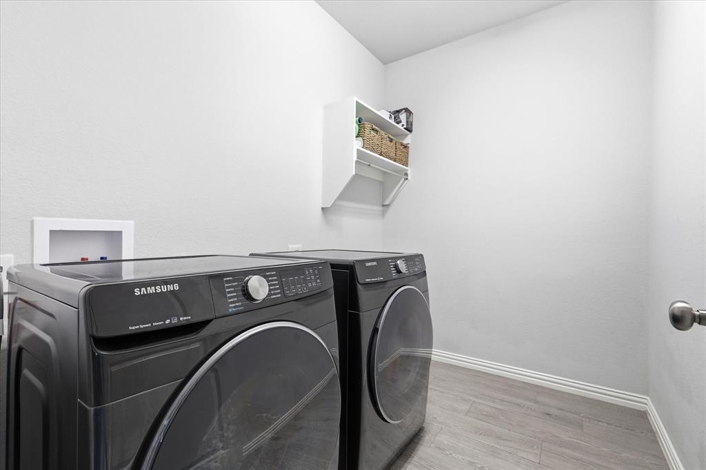 2908 Winding Ridge Court Oak Point, TX 75068 - Photo 24 of 38 Large laundry room with room for more!