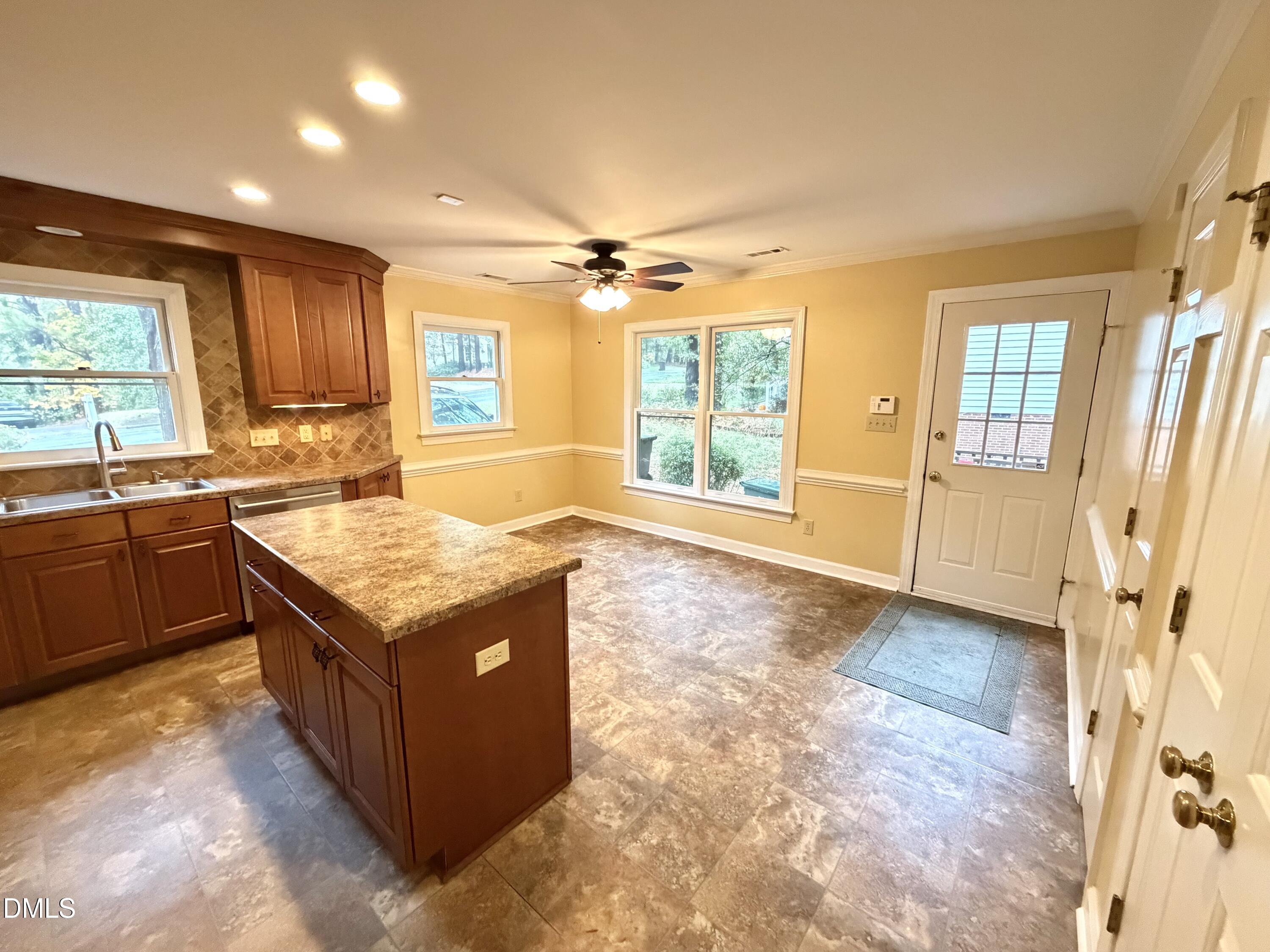 4907 Fortunes Ridge Drive Durham, NC 27713 - Photo 15 of 43 a kitchen with granite countertop a sink and a stove