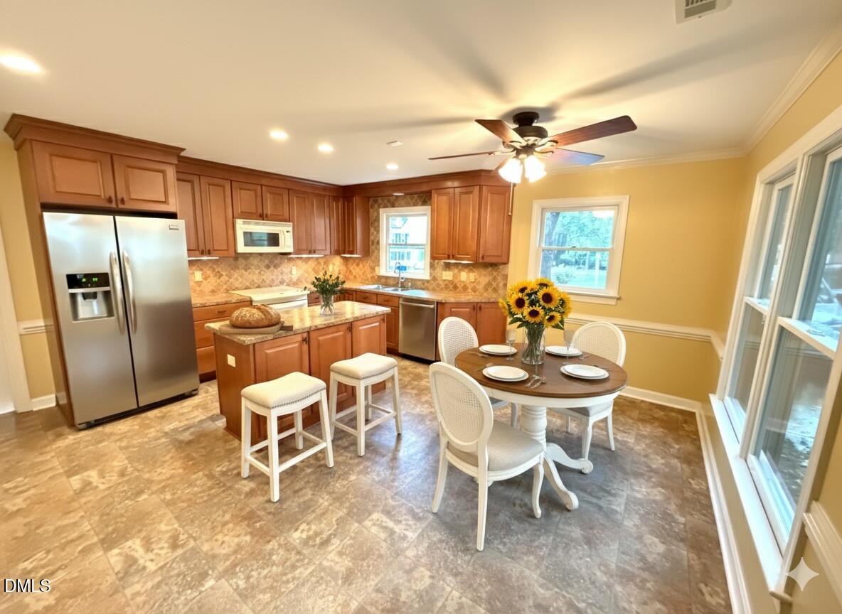 4907 Fortunes Ridge Drive Durham, NC 27713 - Photo 16 of 43 a view of a dining room with furniture