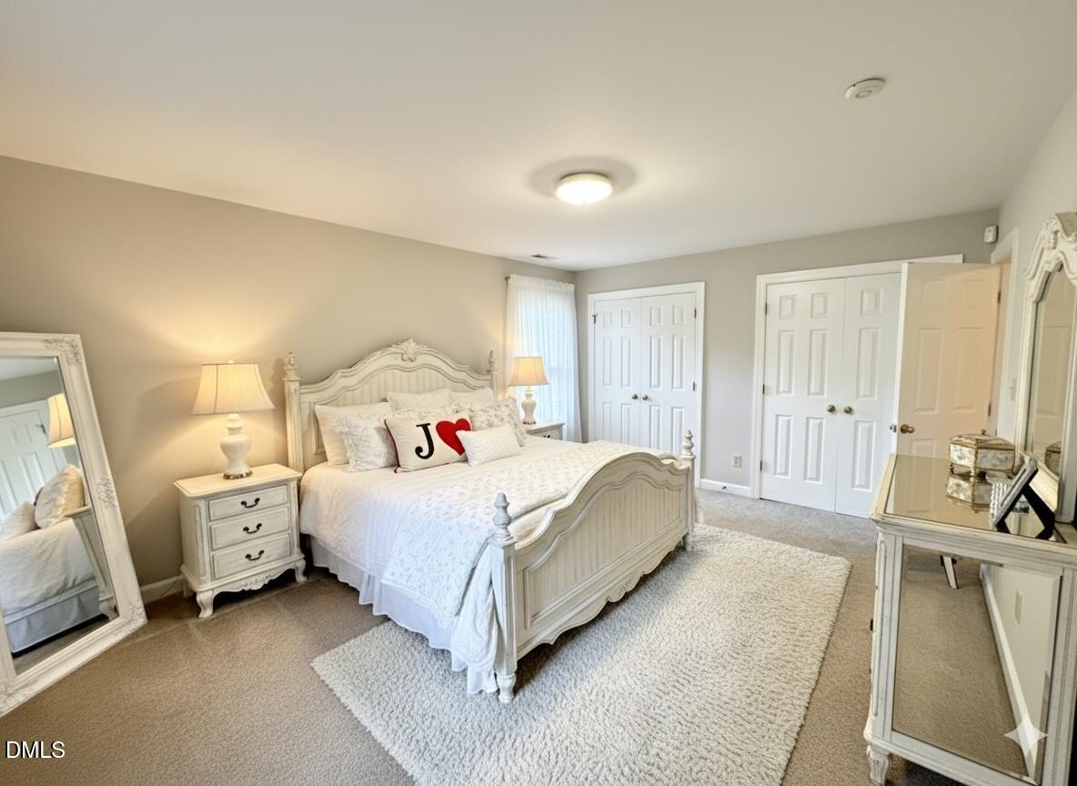4907 Fortunes Ridge Drive Durham, NC 27713 - Photo 21 of 43 a bed room with a bed and a couch