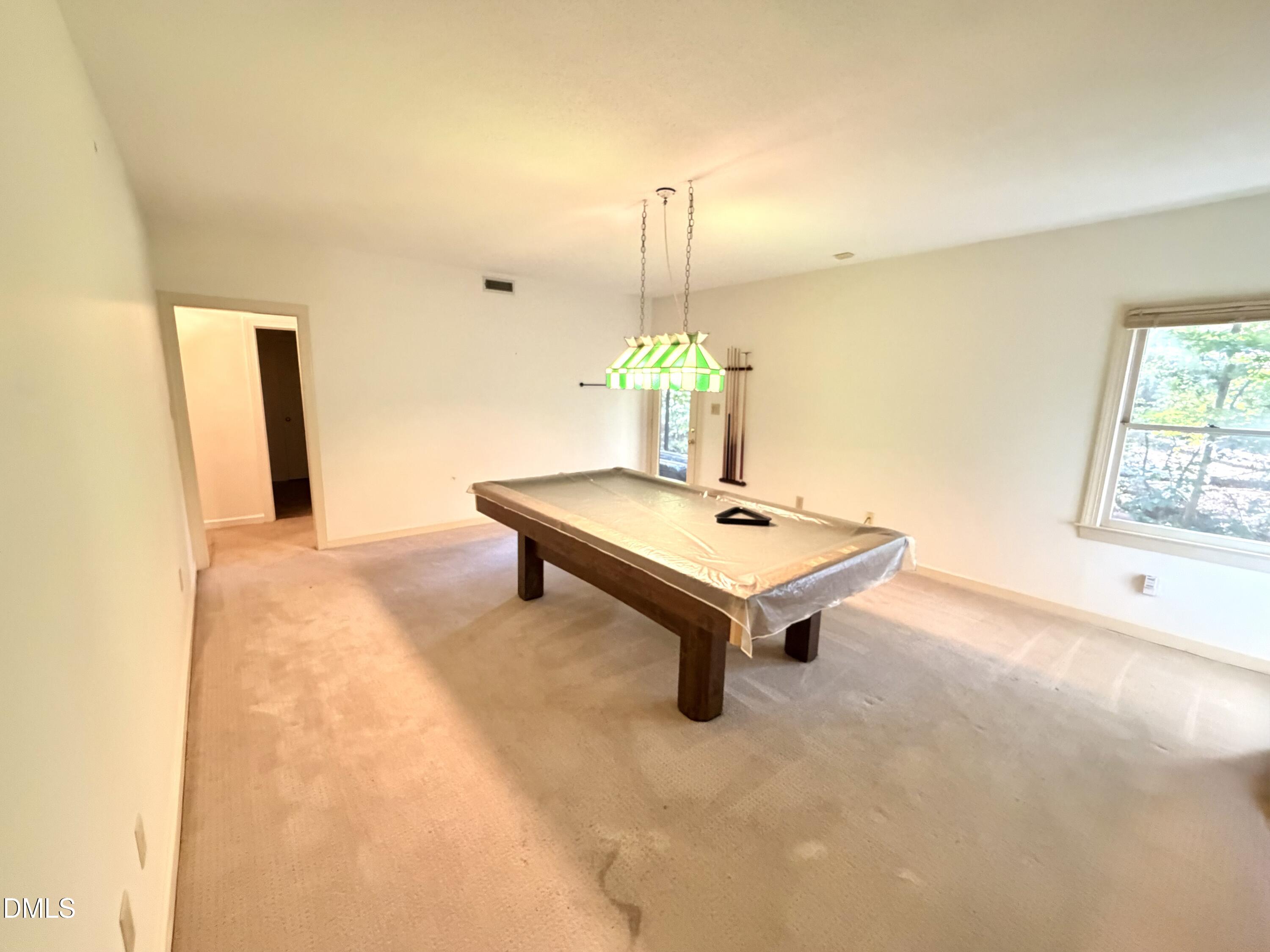 4907 Fortunes Ridge Drive Durham, NC 27713 - Photo 31 of 43 a view of a room with a table and chairs