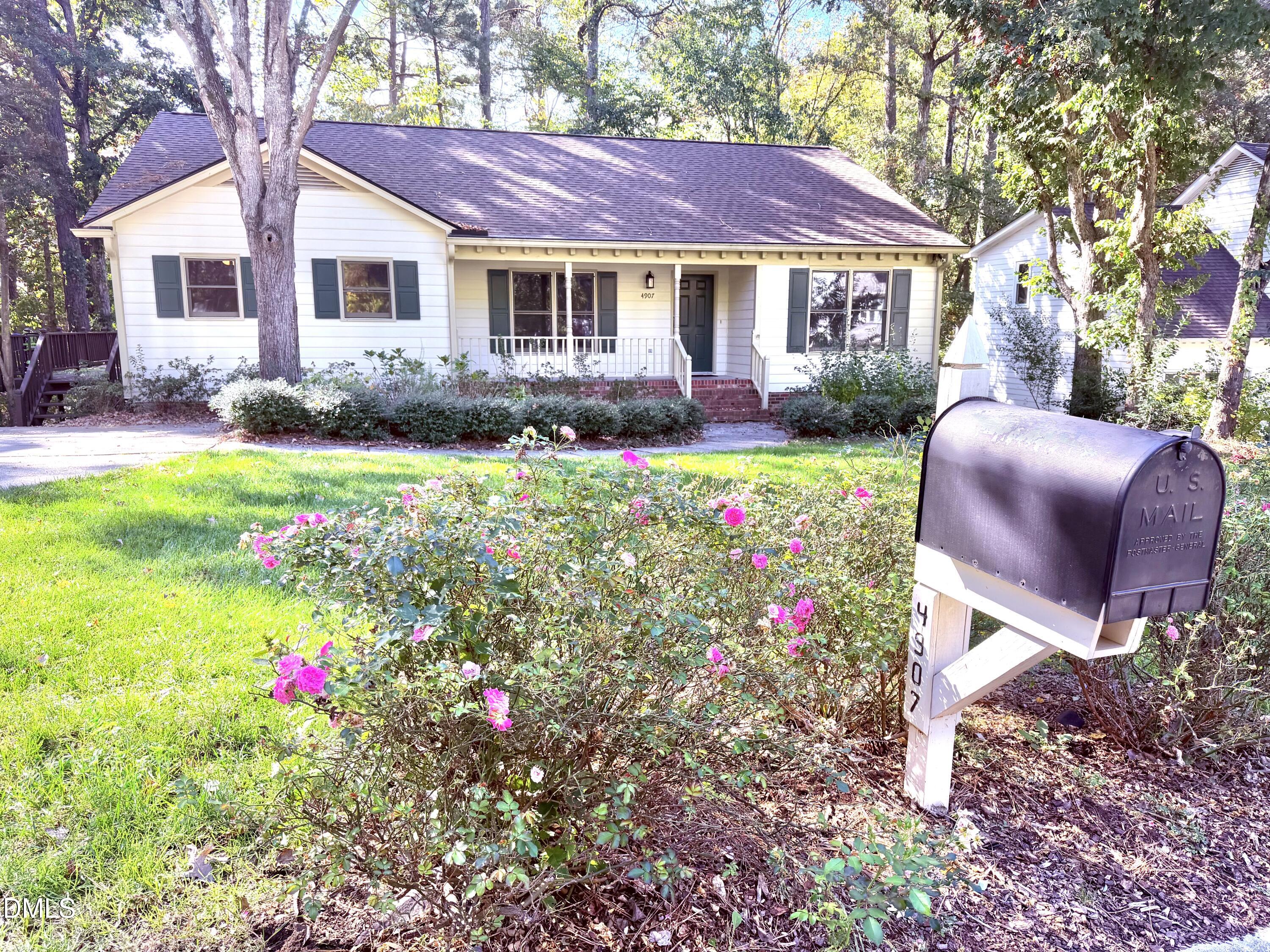 4907 Fortunes Ridge Drive Durham, NC 27713 - Photo 3 of 43 a view of a house with a yard and sitting area