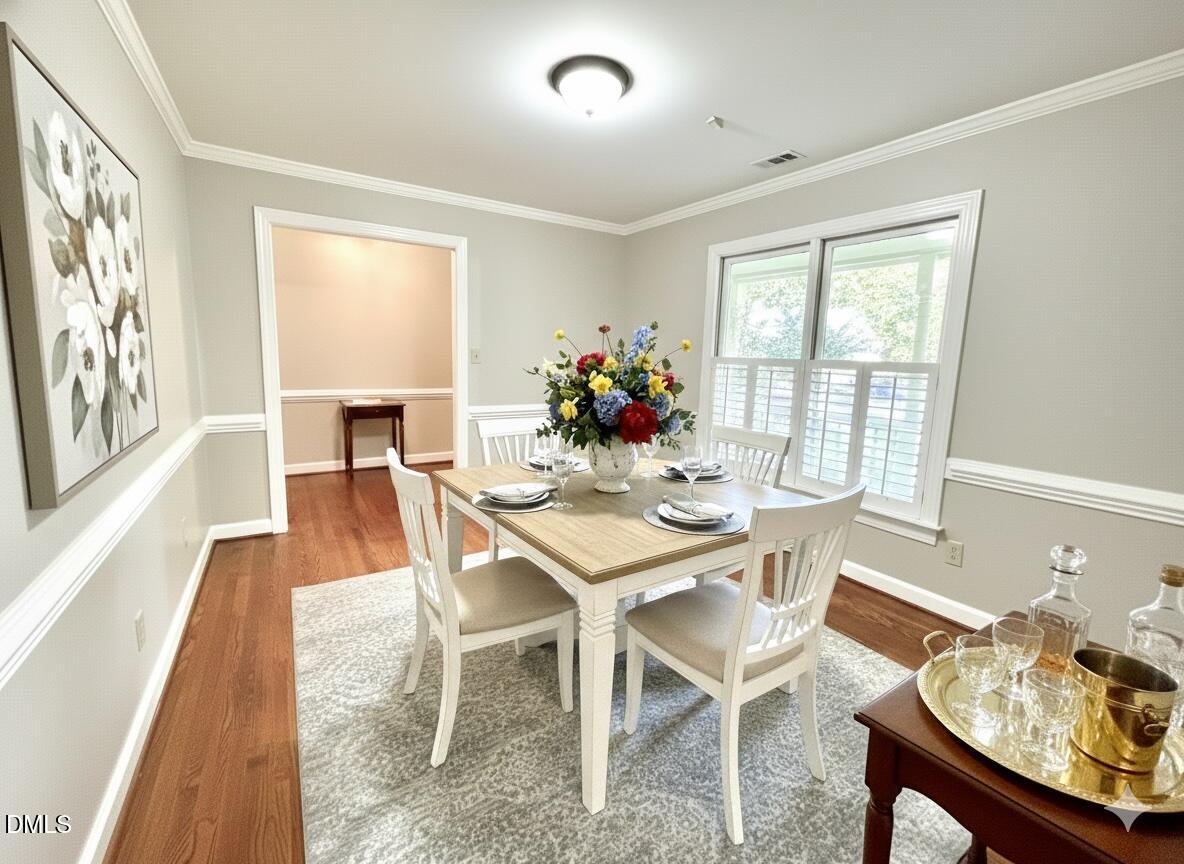4907 Fortunes Ridge Drive Durham, NC 27713 - Photo 7 of 43 a dining room with furniture and window