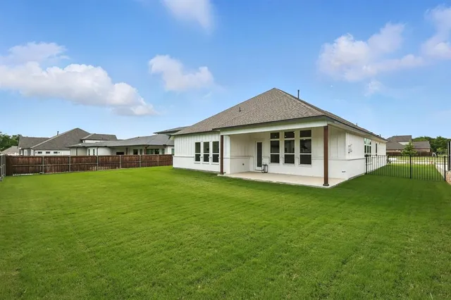 a view of backyard with green space