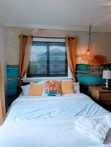 a view of front door and bedroom