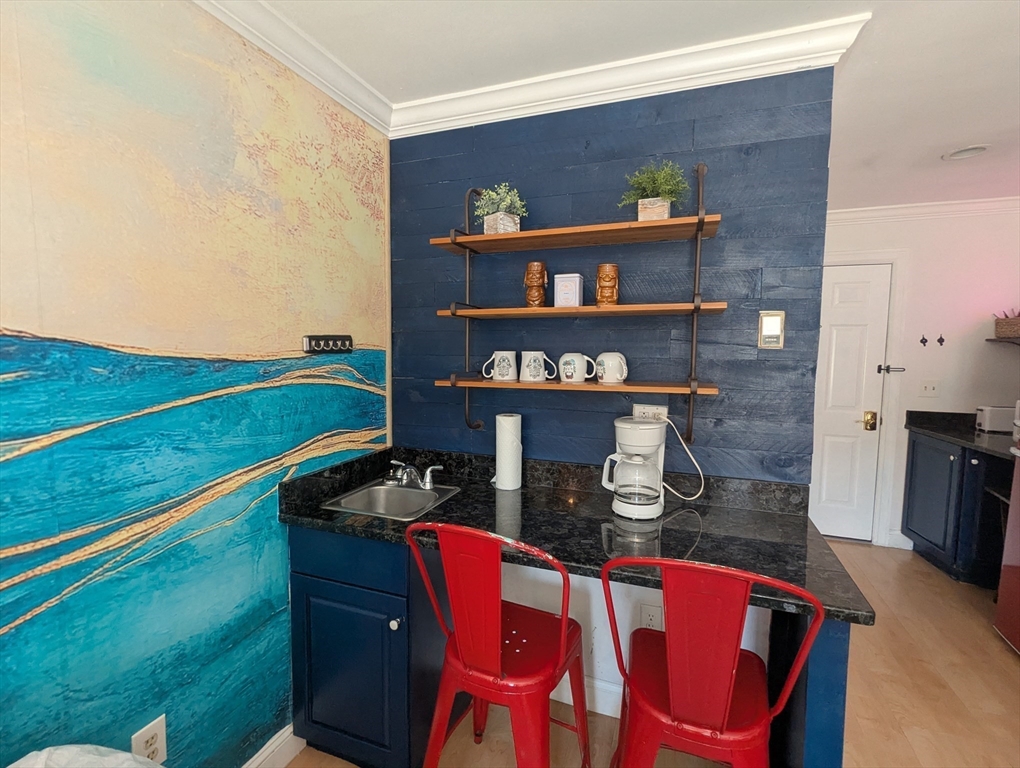 415 Ocean Boulevard, Unit 306 Hampton, NH 03842 - Photo 5 of 11 a front view of a house with a yard