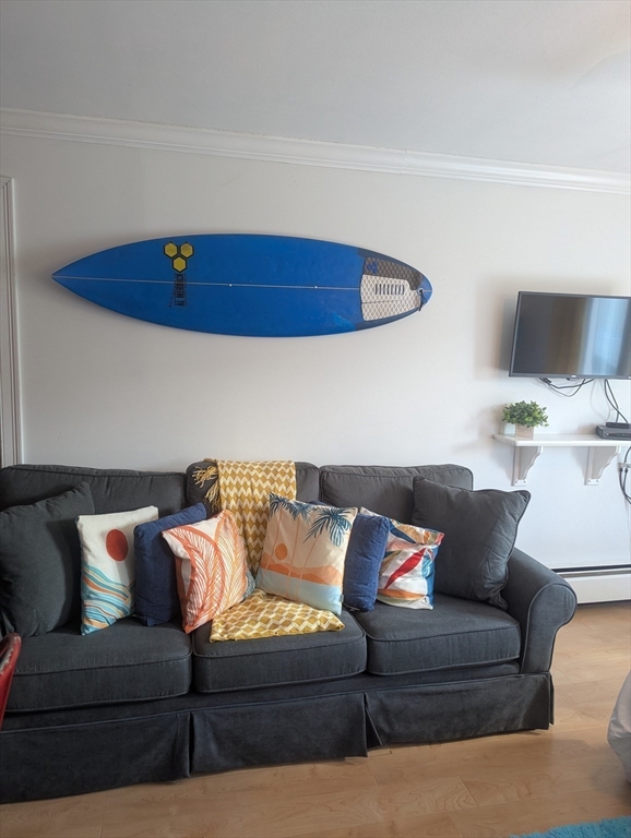 415 Ocean Boulevard, Unit 306 Hampton, NH 03842 - Photo 7 of 11 a living room with furniture and a couch