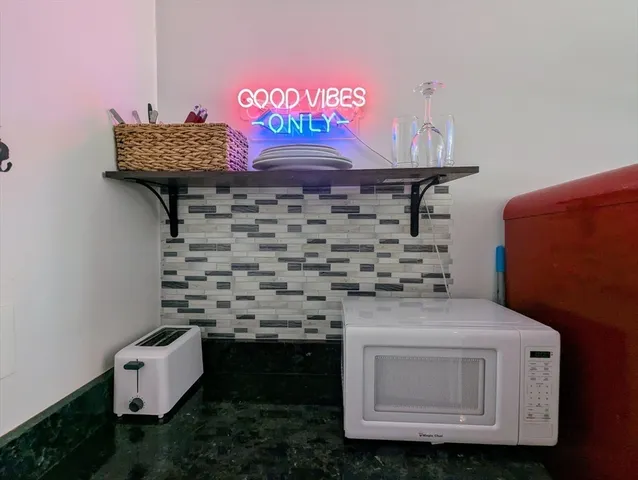 a bathroom with a stove and cabinets