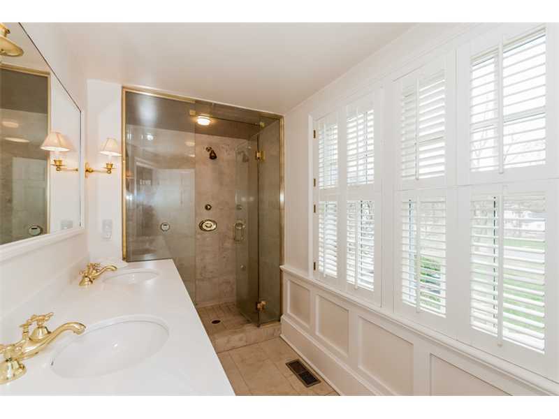 22 Indian Spring Road Rowayton, CT 06853 - Photo 14 of 23 a bathroom with a tub shower and a sink