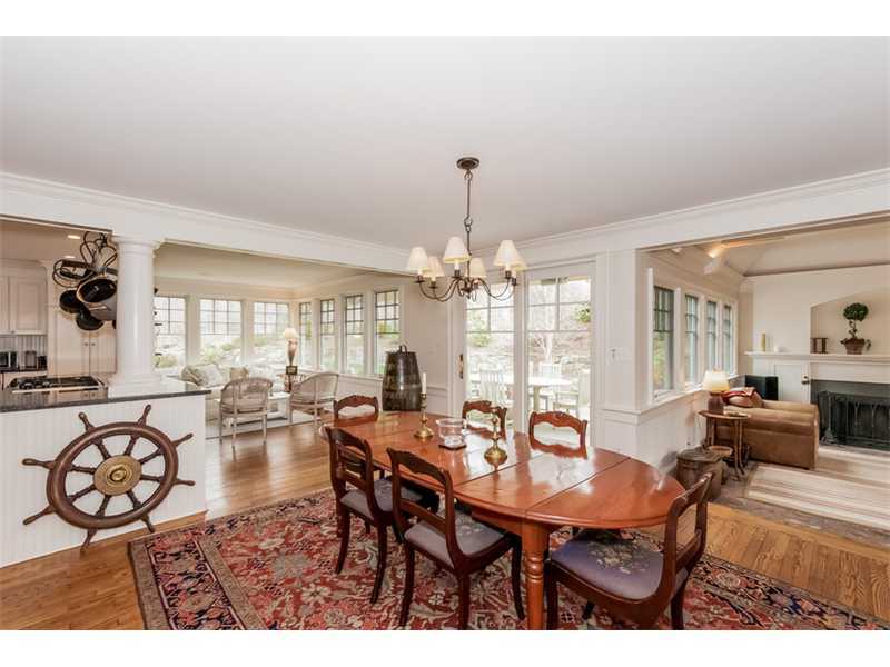 22 Indian Spring Road Rowayton, CT 06853 - Photo 4 of 23 a view of a dining room with furniture wooden floor and chandelier