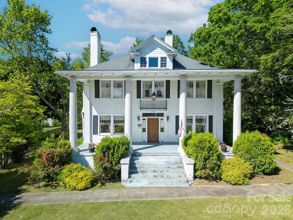 208 West Probart Street Brevard, NC 28712 - Photo 1 of 48 a front view of a house with garden