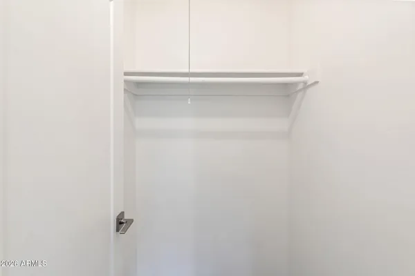 a view of a room with wooden floor and closet