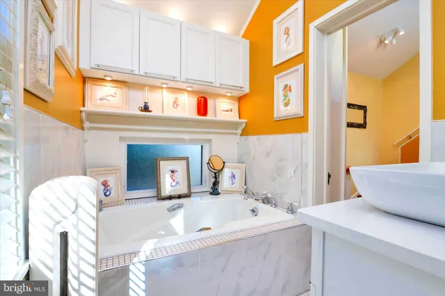 a bathroom with a sink and a bathtub