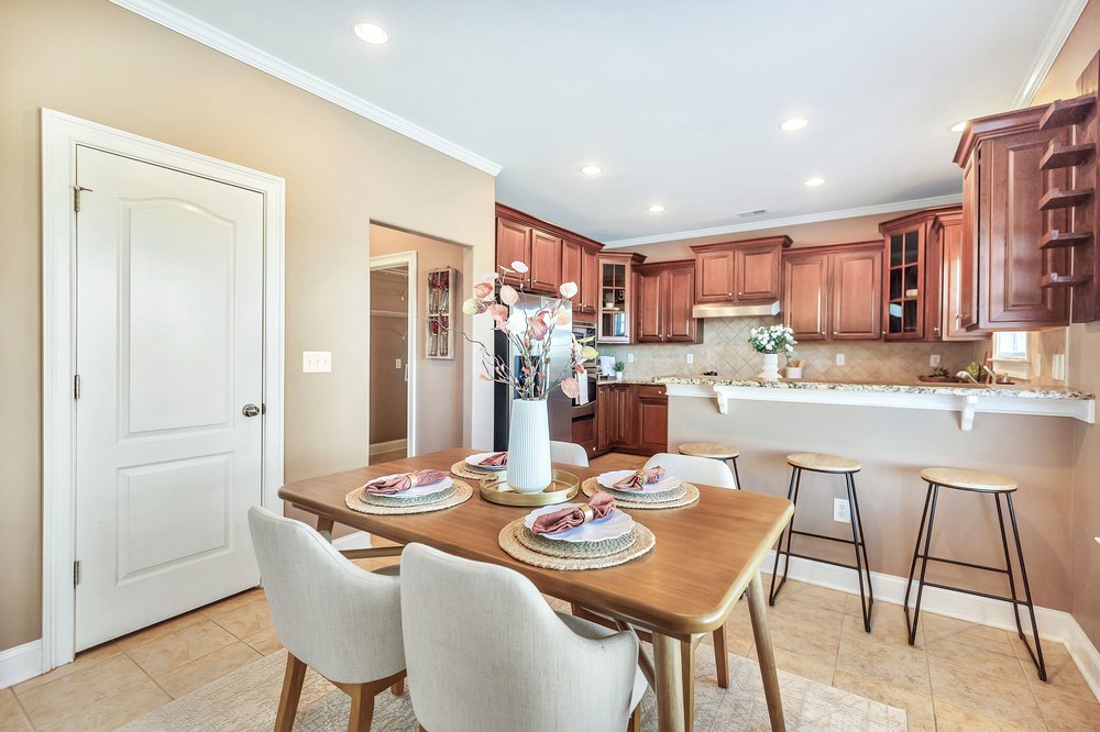 15 Fawn Hill Drive Anderson, SC 29621 - Photo 10 of 38 This inviting dining area seamlessly connects to a well-appointed kitchen, perfect for everyday living.