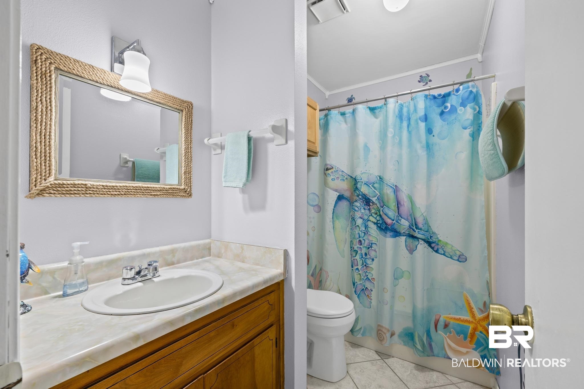 1437 Rio Circle Lillian, AL 36549 - Photo 23 of 46 Full bath with vanity, ornamental molding, and light tile patterned flooring