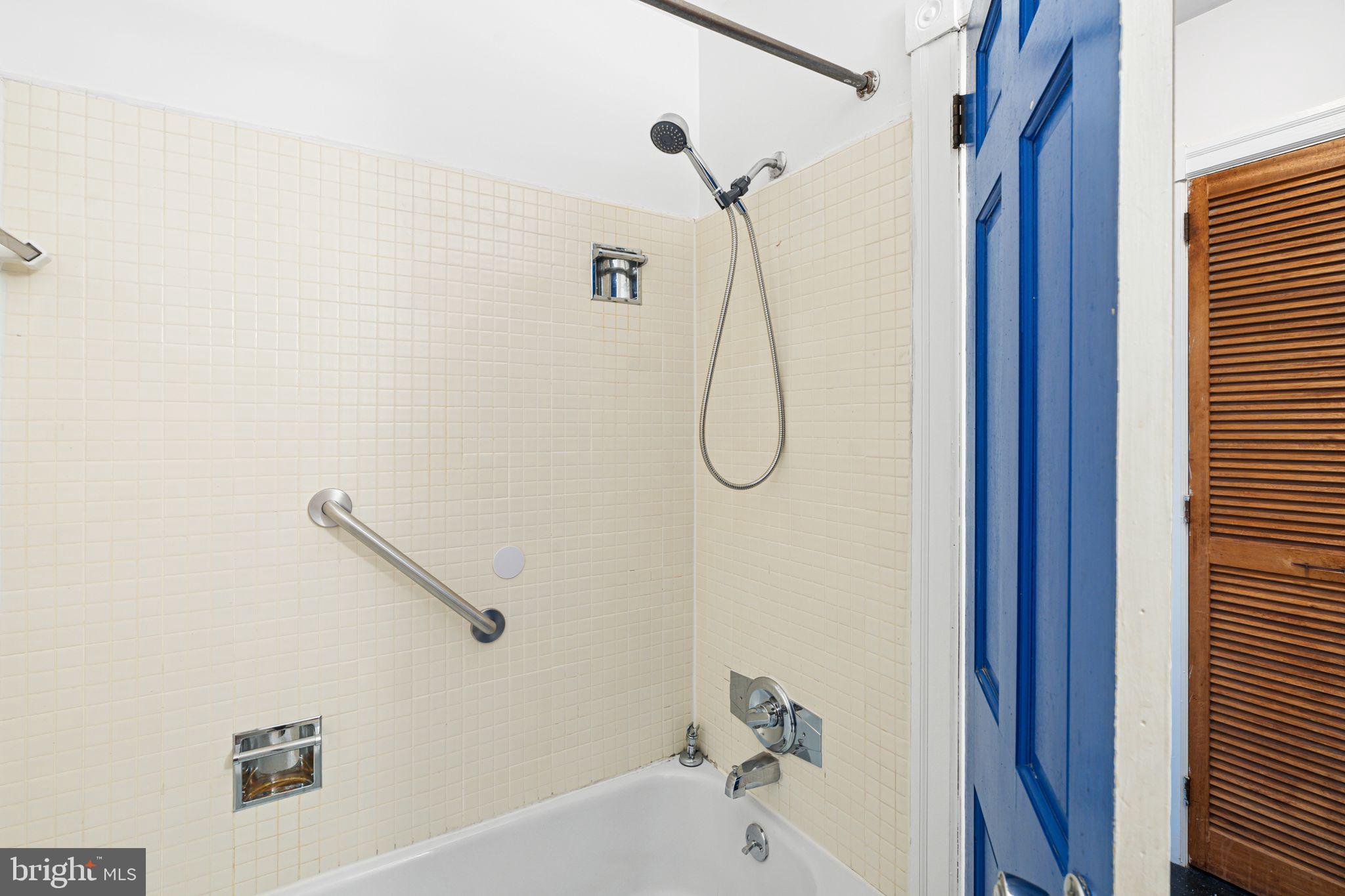 1008 Spruce Street, Unit 21 Philadelphia, PA 19107 - Photo 11 of 16 a bathroom with a bath tub and a shower
