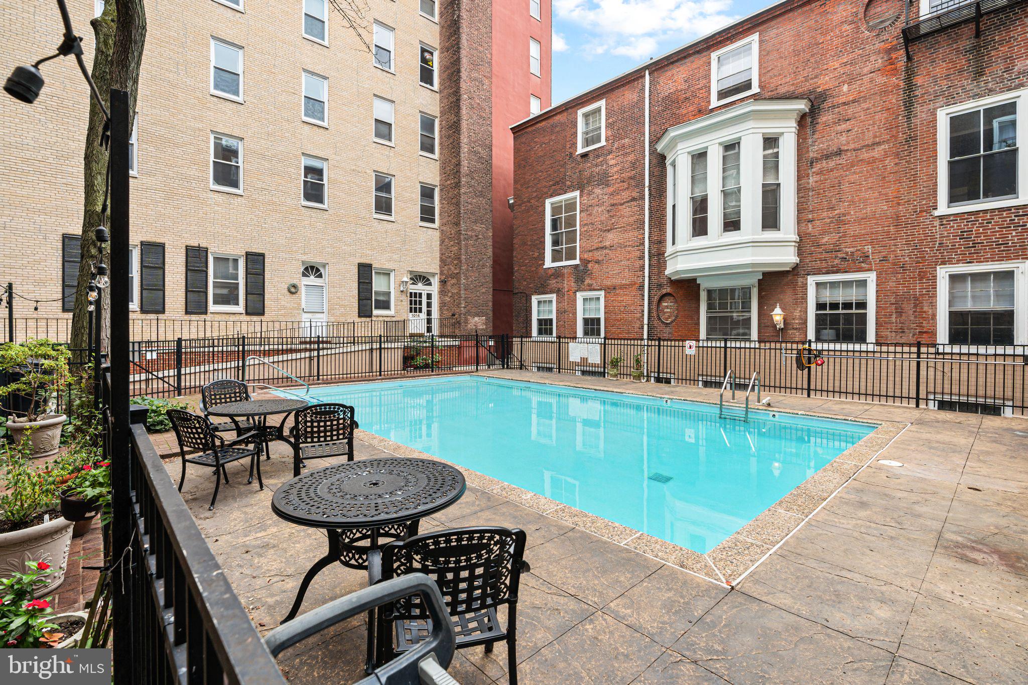 1008 Spruce Street, Unit 21 Philadelphia, PA 19107 - Photo 15 of 16 a view of a patio with table and chairs and potted plants