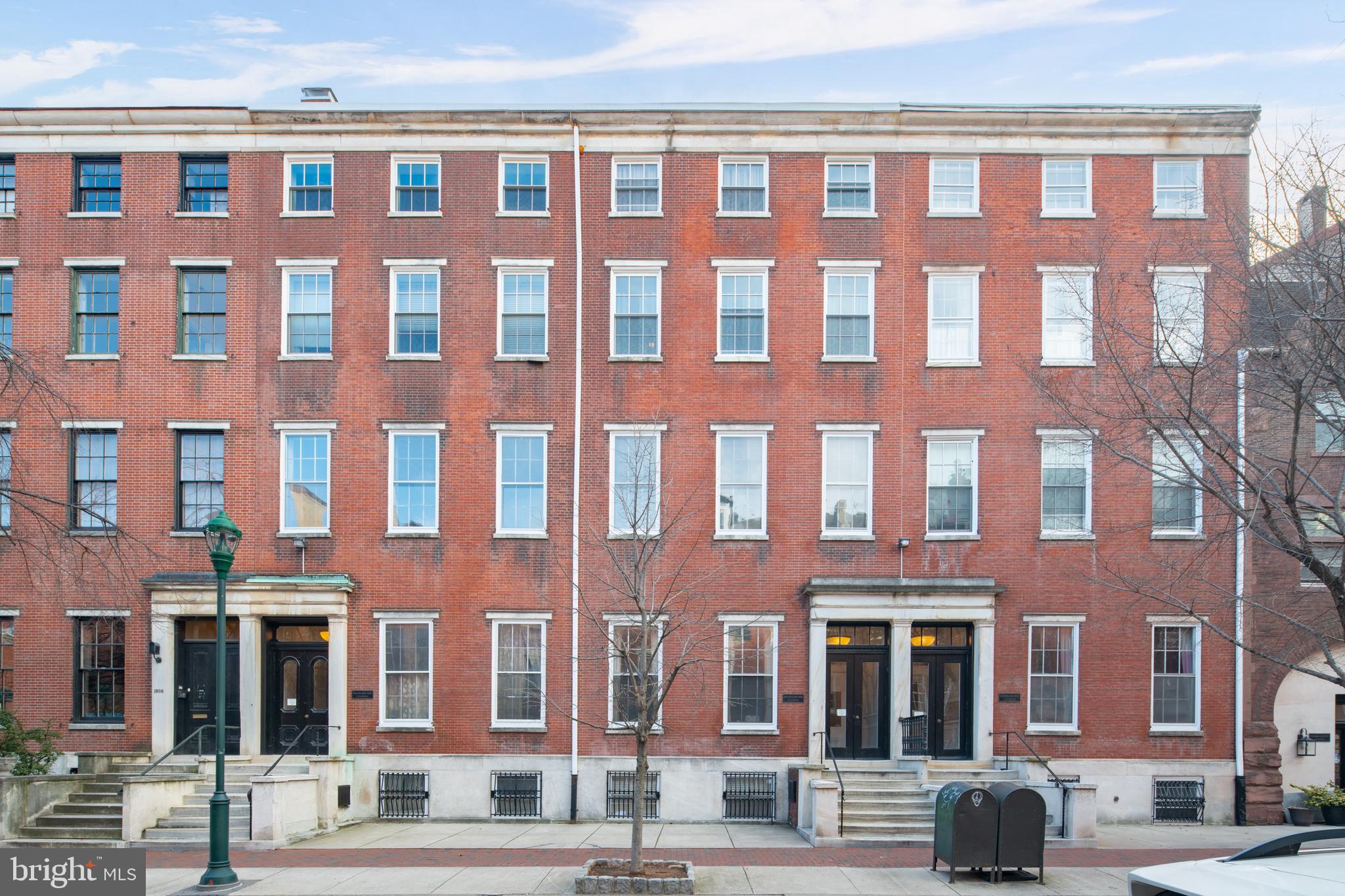 1008 Spruce Street, Unit 21 Philadelphia, PA 19107 - Photo 3 of 16 a front view of a building with parking space