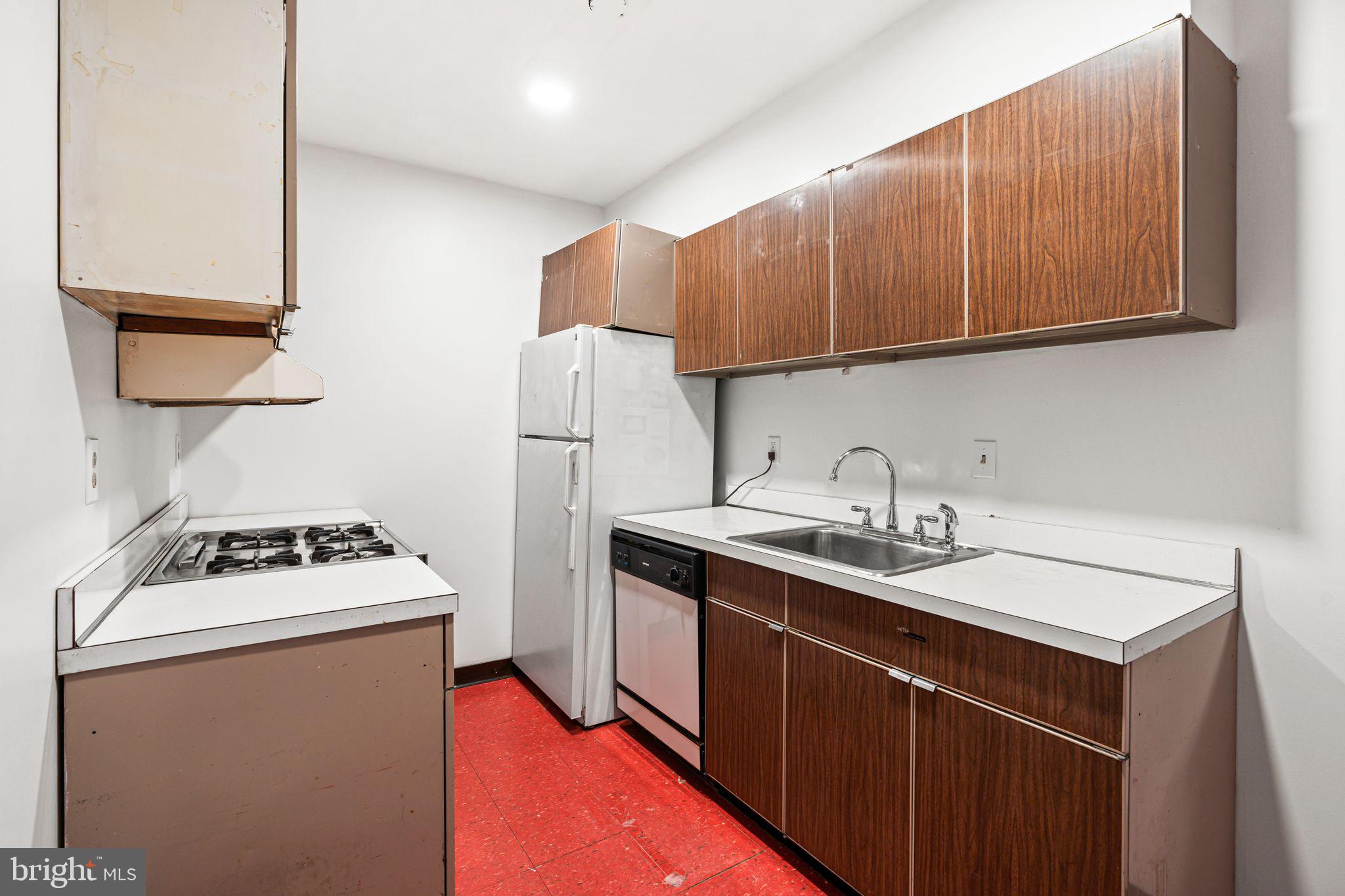1008 Spruce Street, Unit 21 Philadelphia, PA 19107 - Photo 6 of 16 a utility room with cabinets washer and dryer