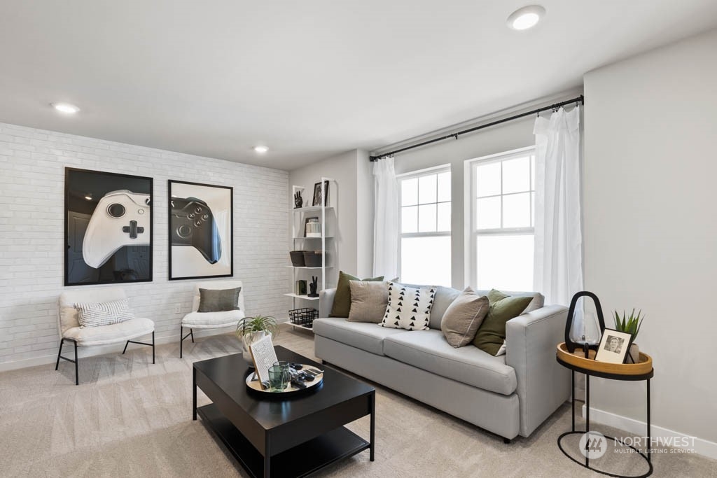616 185th Street Southwest, Unit NCV24 Bothell, WA 98012 - Photo 12 of 25 a living room with furniture and wooden floor