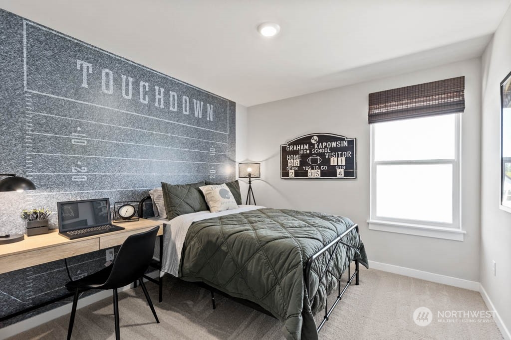 616 185th Street Southwest, Unit NCV24 Bothell, WA 98012 - Photo 15 of 25 a bedroom with a bed a table and a window
