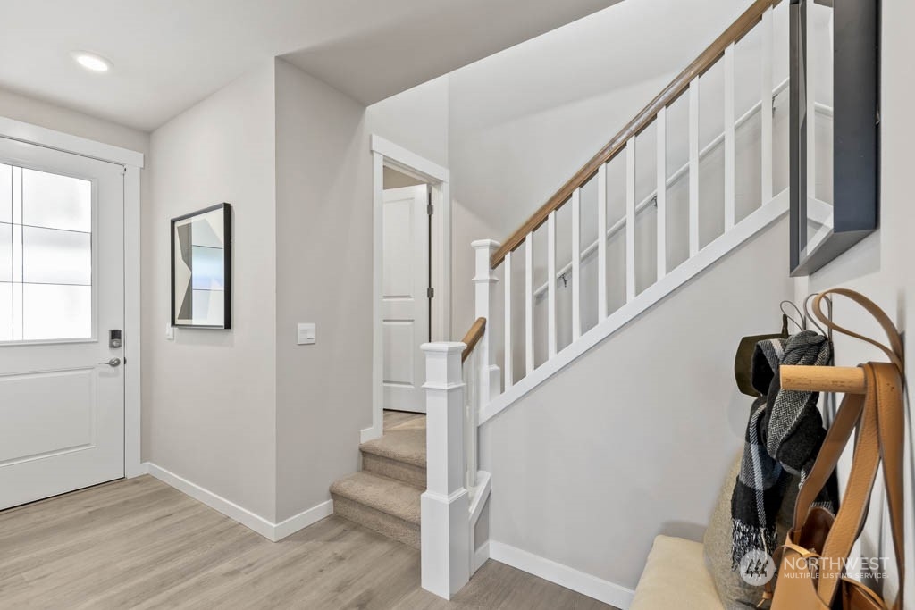 616 185th Street Southwest, Unit NCV24 Bothell, WA 98012 - Photo 3 of 25 a view of an entryway with wooden floor