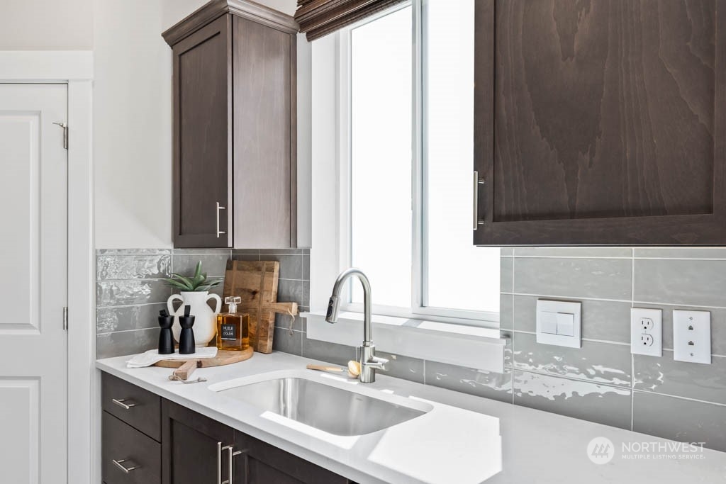 616 185th Street Southwest, Unit NCV24 Bothell, WA 98012 - Photo 10 of 25 a bathroom with a sink and a mirror