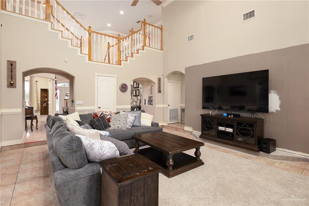 23725 North Val Verde Road Edinburg, TX 78542 - Photo 9 of 36 a living room with furniture and a flat screen tv