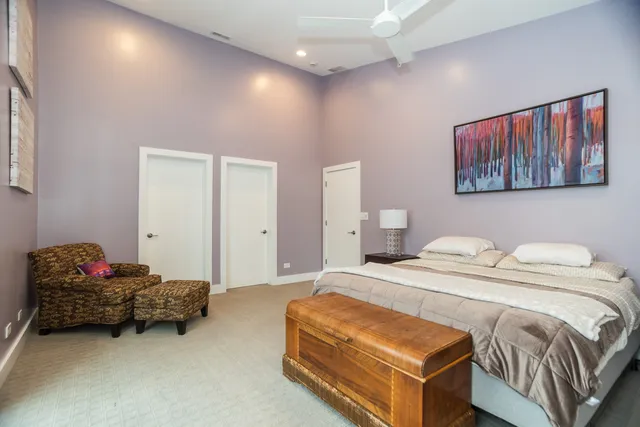 a bedroom with a bed and a couch