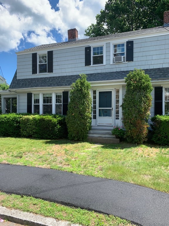 4 Martin Street, Unit 1 Marblehead, MA 01945 - Photo 1 of 13 a view of house with a yard and potted plants