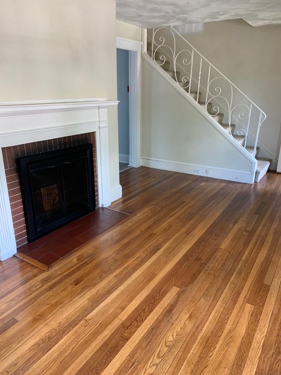 4 Martin Street, Unit 1 Marblehead, MA 01945 - Photo 3 of 13 a view of entryway and hall with wooden floor