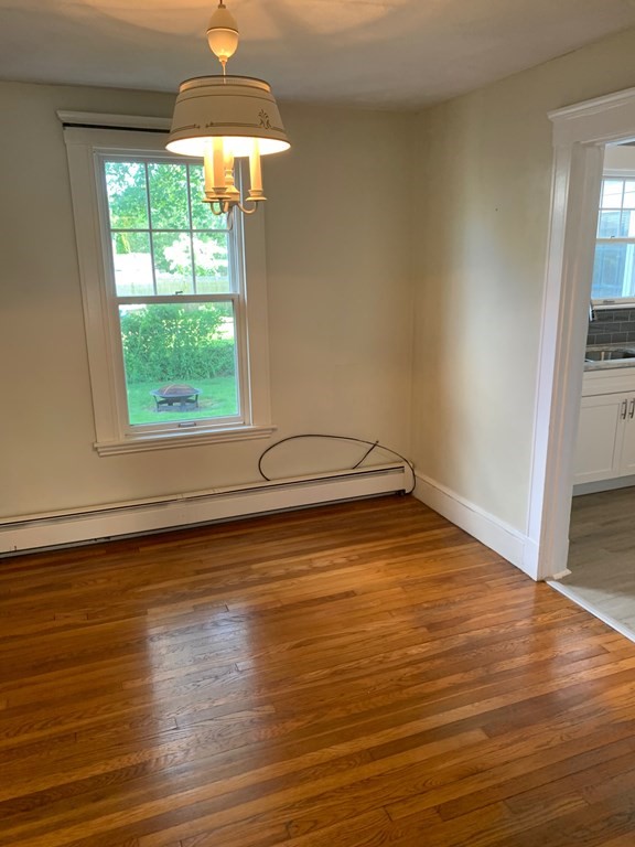 4 Martin Street, Unit 1 Marblehead, MA 01945 - Photo 8 of 13 a view of a room with wooden floor and a window