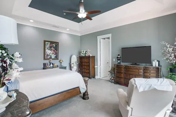 a bedroom with a bed and flat screen tv