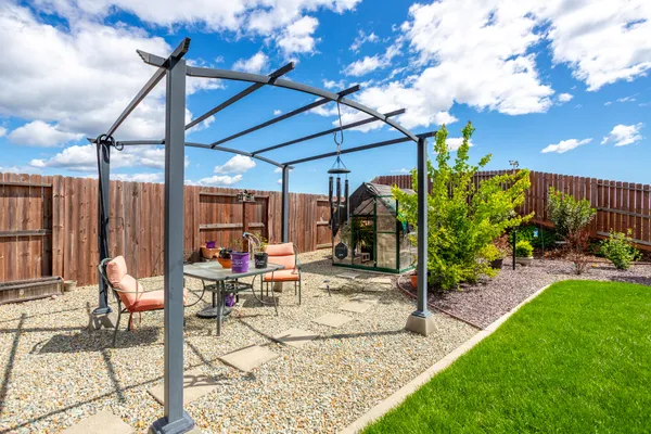 a view of a patio with a table chairs and a patio