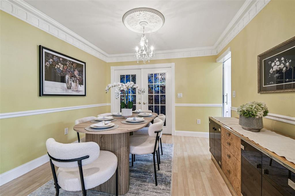 7115 Hummingbird Lane New Port Richey, FL 34655 - Photo 16 of 75 a view of a dining room with furniture window and wooden floor