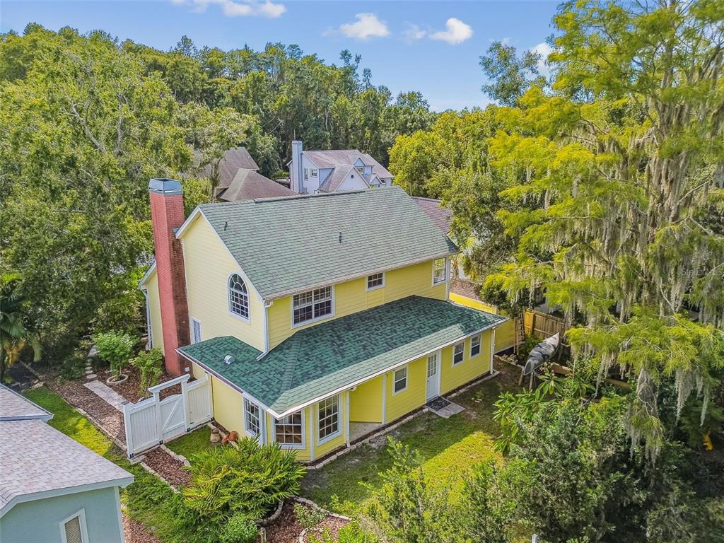 7115 Hummingbird Lane New Port Richey, FL 34655 - Photo 2 of 75 an aerial view of a house with a big yard