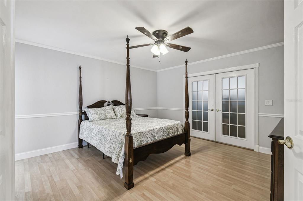 7115 Hummingbird Lane New Port Richey, FL 34655 - Photo 22 of 75 a bedroom with a bed and a window