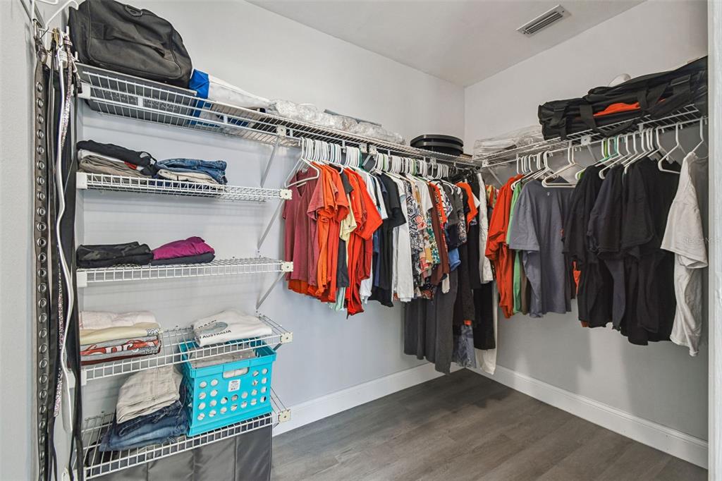 7115 Hummingbird Lane New Port Richey, FL 34655 - Photo 29 of 75 a view of walk in closet with clothes and shoes