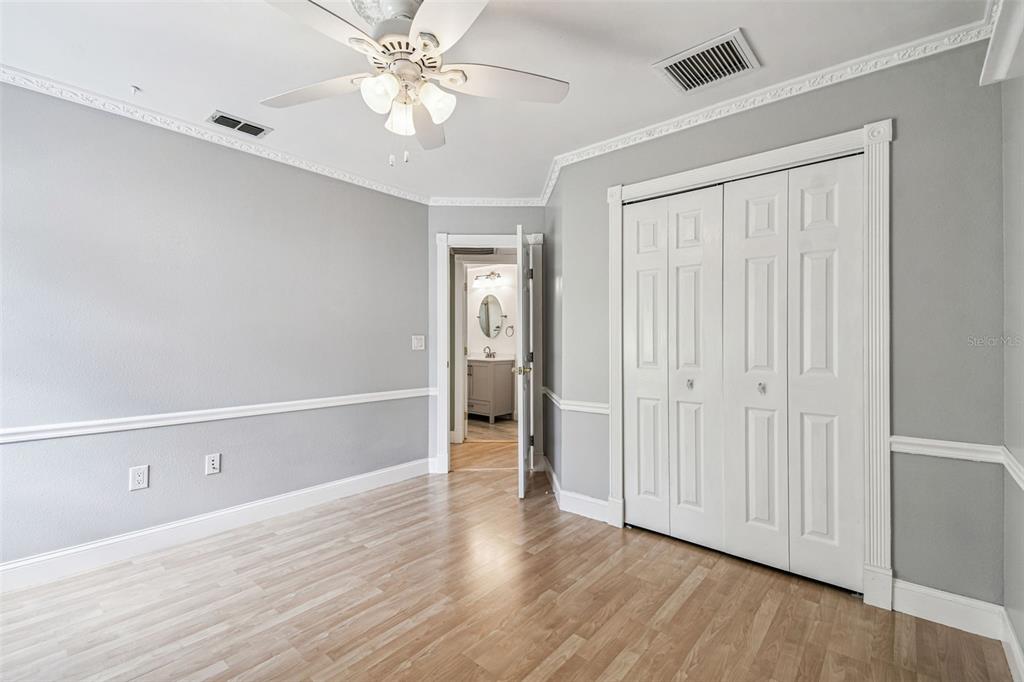 7115 Hummingbird Lane New Port Richey, FL 34655 - Photo 43 of 75 a view of an empty room with wooden floor