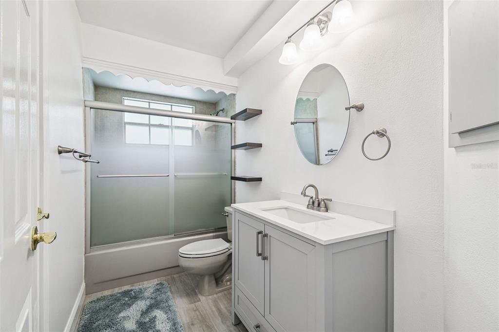 7115 Hummingbird Lane New Port Richey, FL 34655 - Photo 44 of 75 a bathroom with a sink a toilet and shower