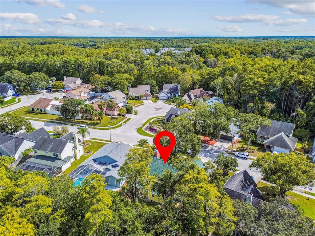 7115 Hummingbird Lane New Port Richey, FL 34655 - Photo 65 of 75 an aerial view of residential houses with outdoor space and swimming pool
