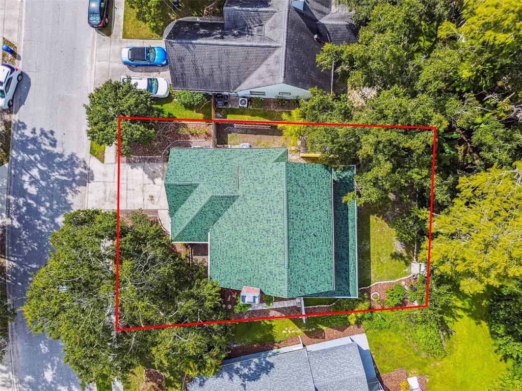 7115 Hummingbird Lane New Port Richey, FL 34655 - Photo 66 of 75 a green field with flowers and trees