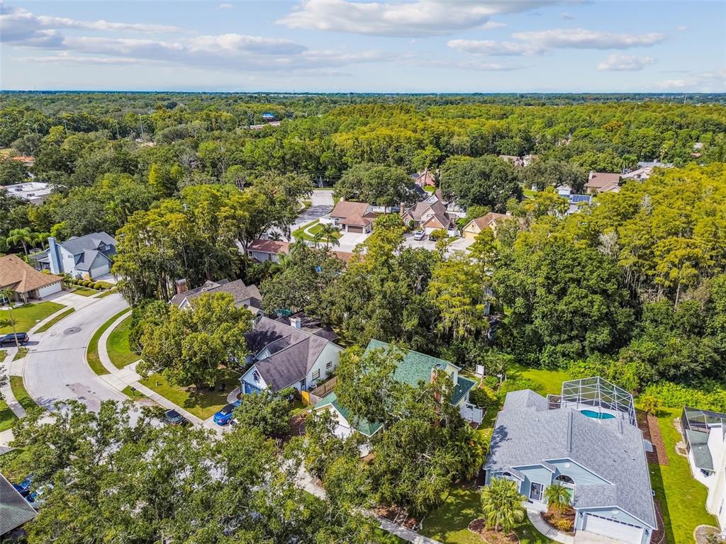 7115 Hummingbird Lane New Port Richey, FL 34655 - Photo 71 of 75 an aerial view of residential house with outdoor space and swimming pool