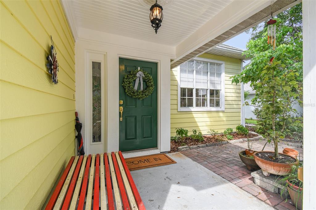 7115 Hummingbird Lane New Port Richey, FL 34655 - Photo 8 of 75 a backyard of a house with seating space