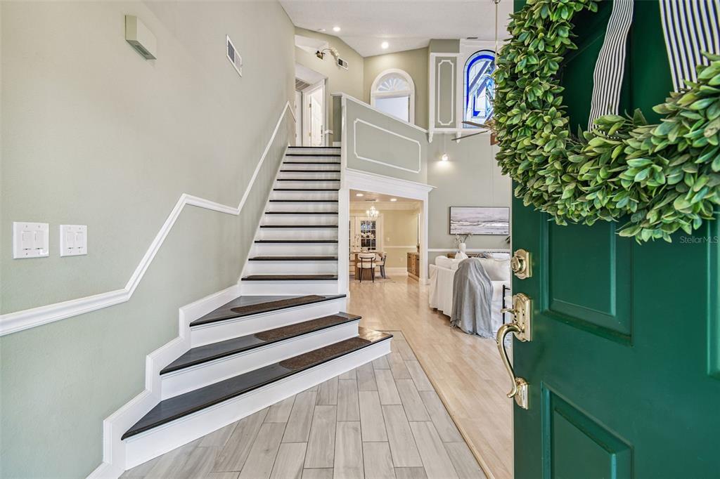 7115 Hummingbird Lane New Port Richey, FL 34655 - Photo 9 of 75 a view of entryway and hall with wooden floor
