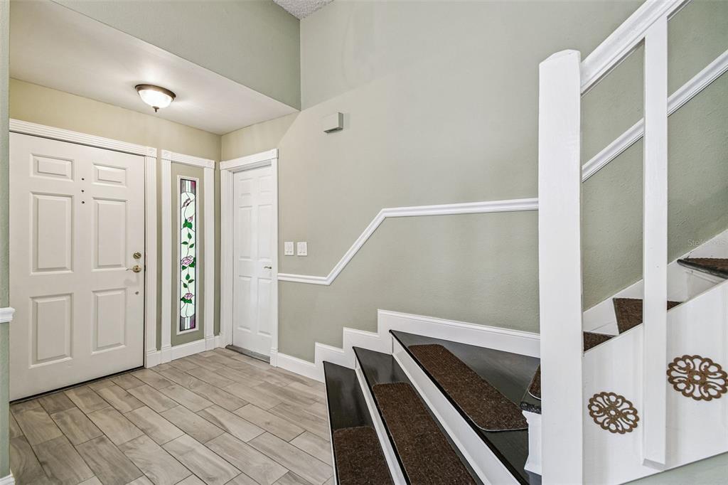 7115 Hummingbird Lane New Port Richey, FL 34655 - Photo 10 of 75 a view of an entryway with wooden floor