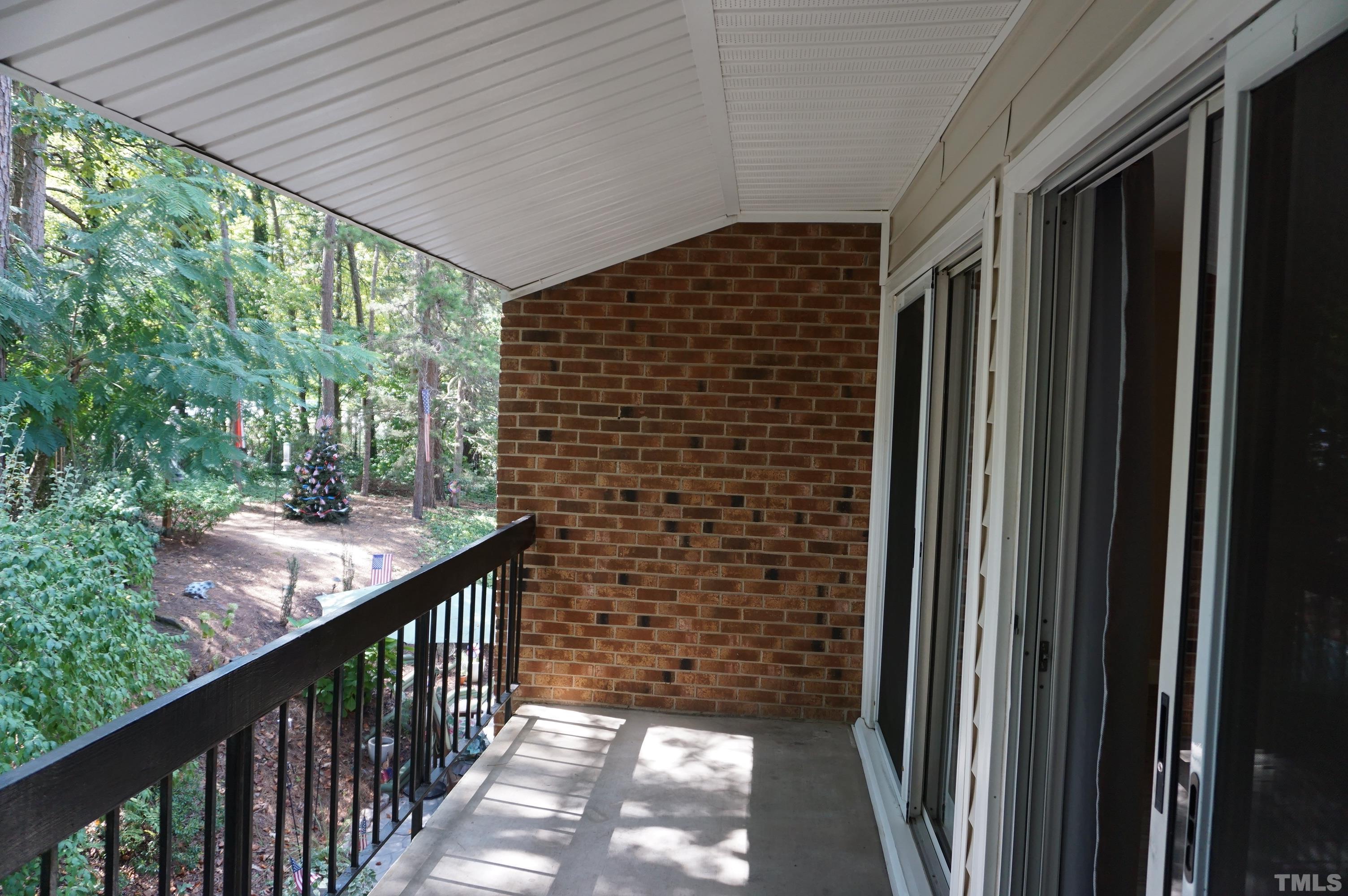 4505 Edwards Mill Road, Unit F Raleigh, NC 27612 - Photo 30 of 34 a view of balcony